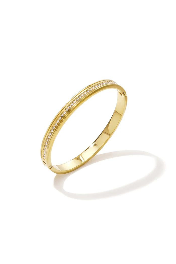 Gold hinged bangle bracelet with a row of pavé crystals