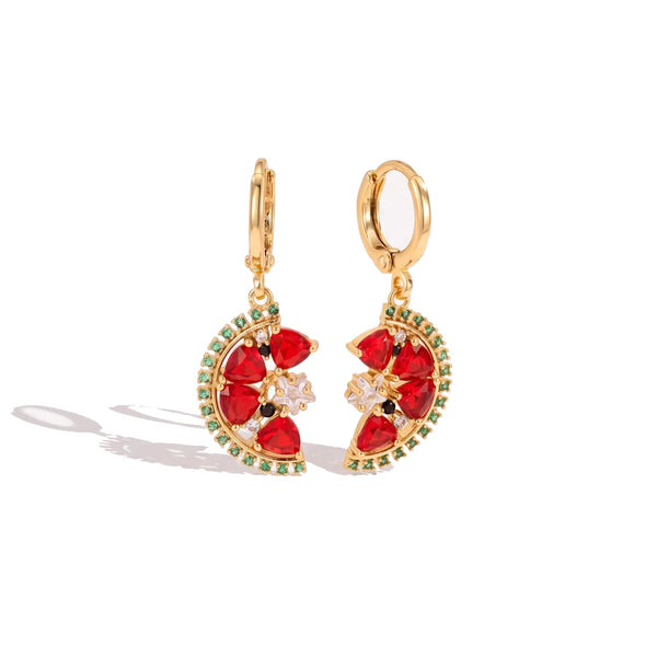 A pair of gold hoop earrings with crescent-shaped red gemstone clusters, accented by small green stones and a central clear crystal, shown on a white background.