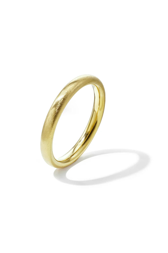 A gold-plated stainless steel bangle featuring a soft brushed satin finish against a white background. mila-brushed-satin-gold-bangle.webp