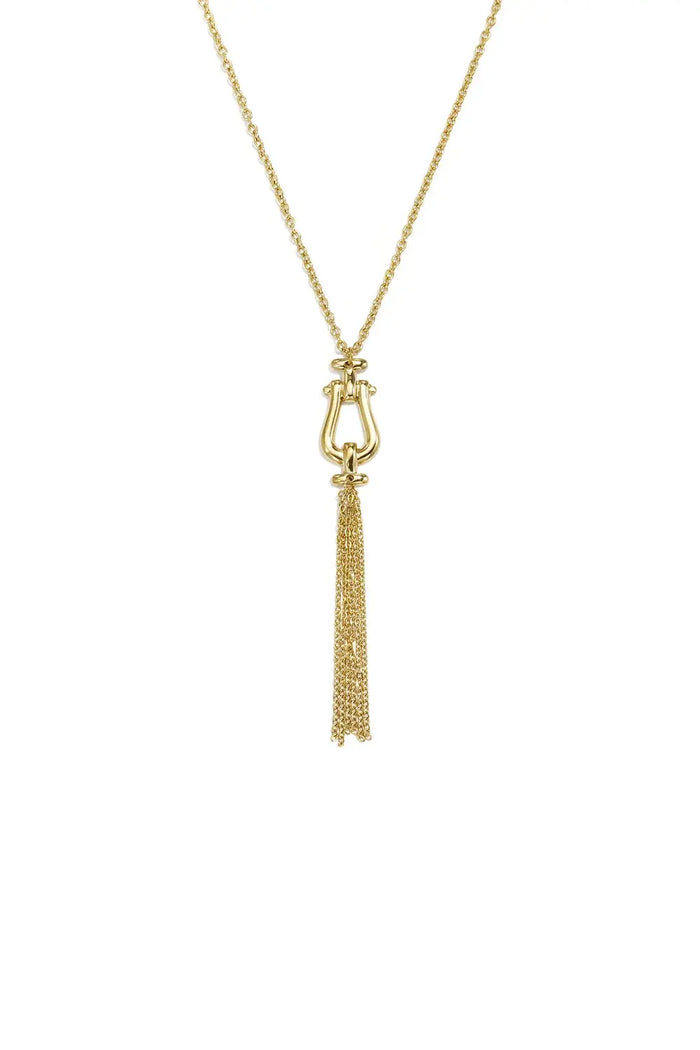A gold-plated stainless steel pendant necklace featuring a horseshoe-shaped stirrup link and a cascading fine chain tassel against a white background. seraphina-stirrup-chain-tassel-necklace.webp