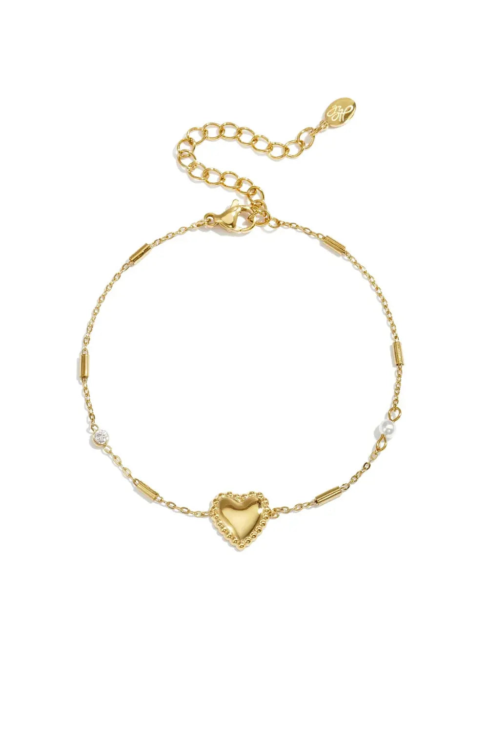 A gold-plated stainless steel chain station bracelet featuring a central beaded-border heart, cylindrical bar links, a small clear cubic zirconia stone, and a tiny pearl accent. adore-beaded-heart-station-bracelet.webp