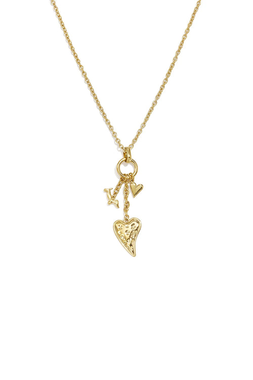 A gold-plated stainless steel necklace featuring a cluster of three charms including a large hammered heart, a smooth puffed heart, and a mini charm on a delicate chain against a white background. amara-multi-charm-cluster-heart-necklace.webp