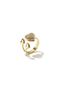 A gold-plated stainless steel adjustable bypass ring featuring a large cubic zirconia pavé heart paired with two small polished gold hearts on a tiered split band against a white background. amor-multi-heart-bypass-adjustable-ring.webp