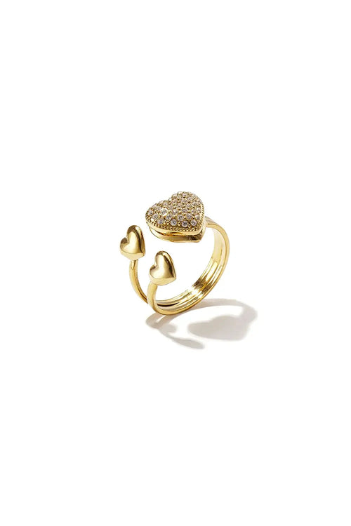 A gold-plated stainless steel adjustable bypass ring featuring a large cubic zirconia pavé heart paired with two small polished gold hearts on a tiered split band against a white background. amor-multi-heart-bypass-adjustable-ring.webp