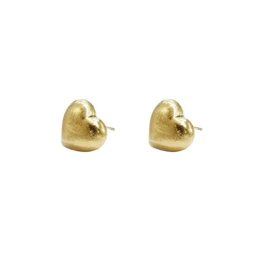 A pair of gold-plated stud earrings featuring a three-dimensional puffy heart shape with a unique matte hand-brushed satin finish. amour-brushed-heart-studs.webp