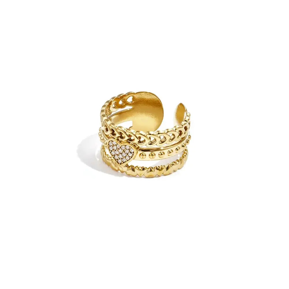 A wide gold-plated stainless steel multi-layer adjustable ring featuring a braided band, a crystal pave heart, a studded line, and a repeating puffy heart row. amour-multi-layer-heart-statement-ring.webp