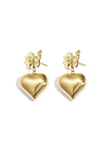 A pair of gold-plated drop earrings featuring a detailed 3D ribbon bow stud post suspending a large, high-polish three-dimensional puffy heart charm. amour-heart-bow-earrings.webp