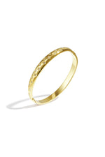 A gold-plated stainless steel hinged bangle featuring engraved heart and starburst motifs with embedded cubic zirconia crystals against a white background. aurelia-engraved-heart-celestial-star-bangle.webp