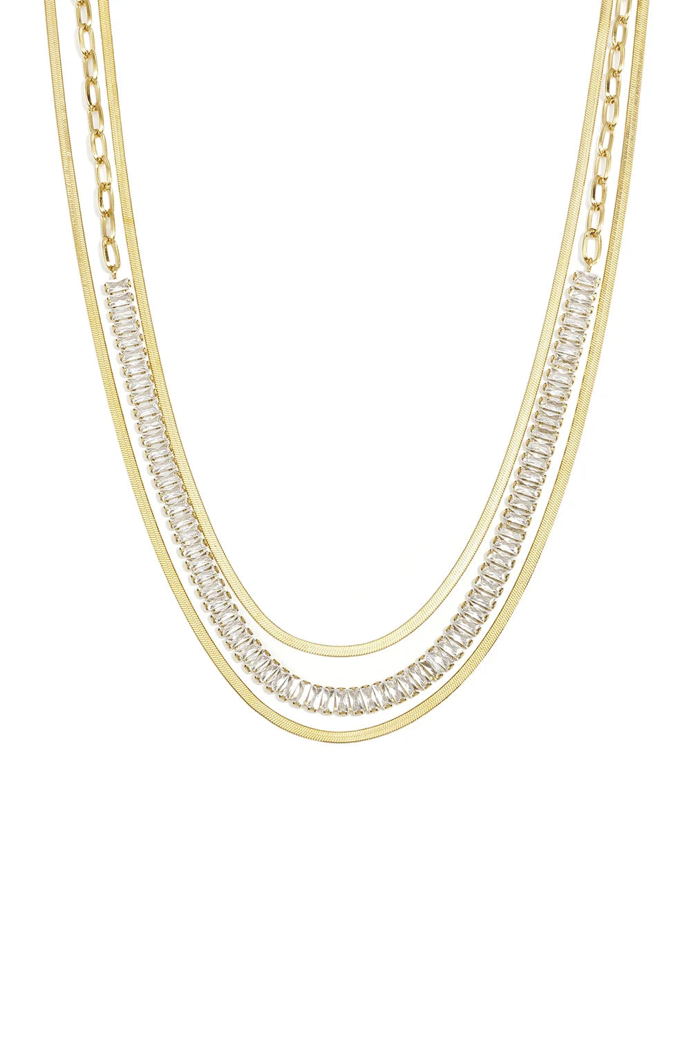 A gold-plated stainless steel multi-layered necklace featuring two flat herringbone chains framing a paperclip link chain with channel-set baguette cubic zirconia crystals against a white background. celeste-layered-herringbone-baguette-crystal-necklace.webp