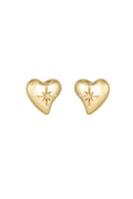 A pair of gold-plated stainless steel stud earrings featuring a smooth, three-dimensional asymmetrical puffy heart with an intricate raised beaded starburst centerpiece holding a clear cubic zirconia crystal against a white background. celeste-puffy-heart-starburst-stud-earrings.webp