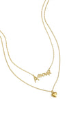 A gold-plated pre-layered double strand necklace featuring a scripted cursive Amour pendant on the top chain and a small 3D puffy heart charm on the bottom chain. cherie-amour-double-layer-heart-necklace.webp