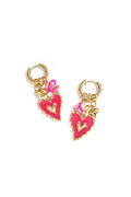 Pair of gold huggie hoop earrings featuring a cluster of charms including a scalloped hot pink enamel heart, a mini gold heart, and bright pink beads on a white background.