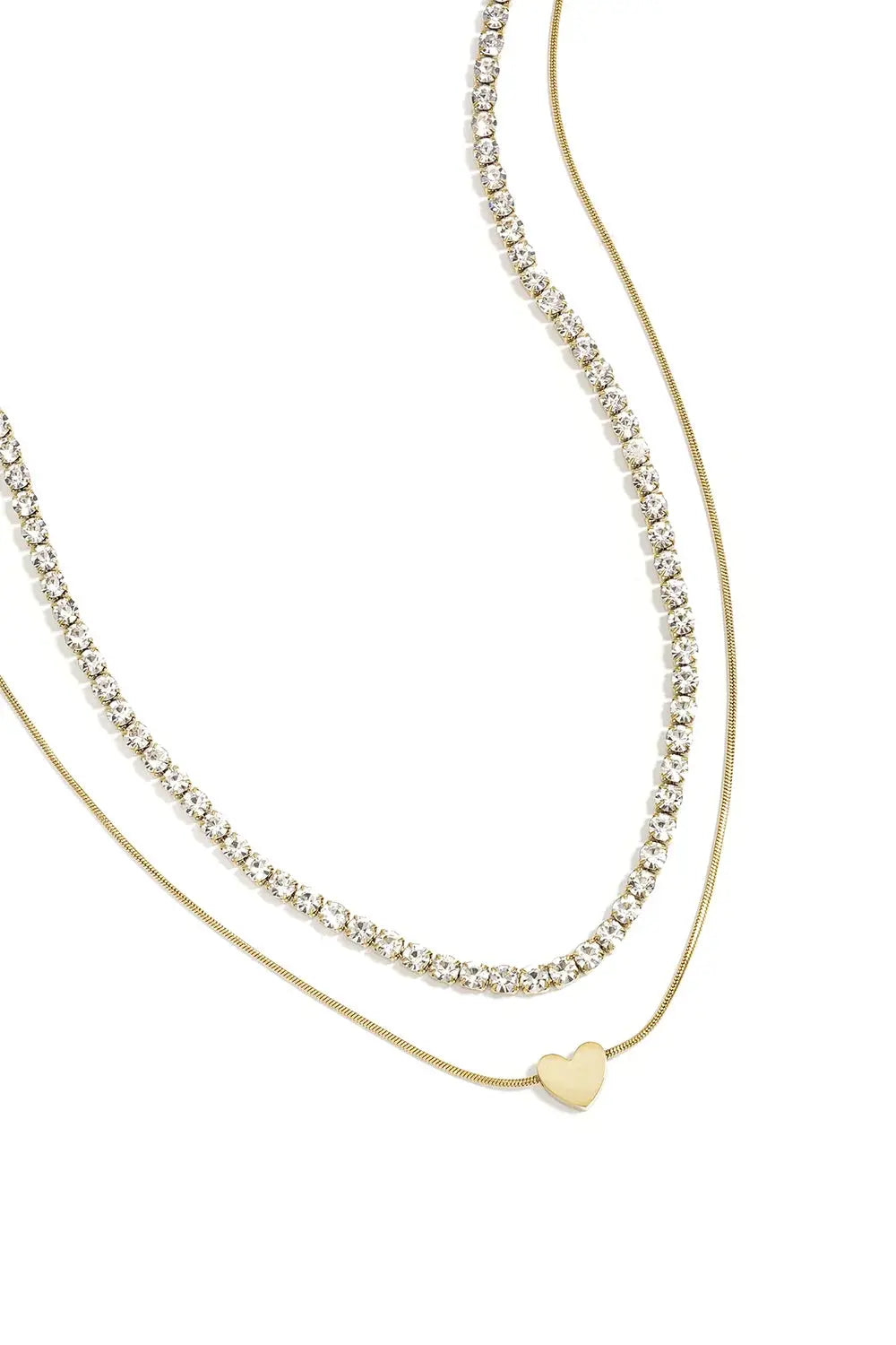 A gold-plated stainless steel multi-layer necklace featuring a top tier clear cubic zirconia tennis chain and a bottom tier gold snake chain with a flat heart charm. cherie-multi-layer-tennis-heart-necklace.webp