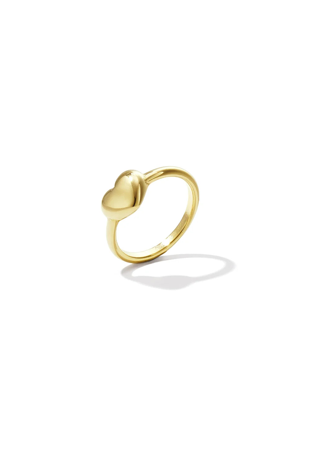 A gold-plated stainless steel dainty minimalist ring featuring a smooth, high-polish three-dimensional puffy heart center against a white background. cherie-puffy-heart-minimalist-ring.webp