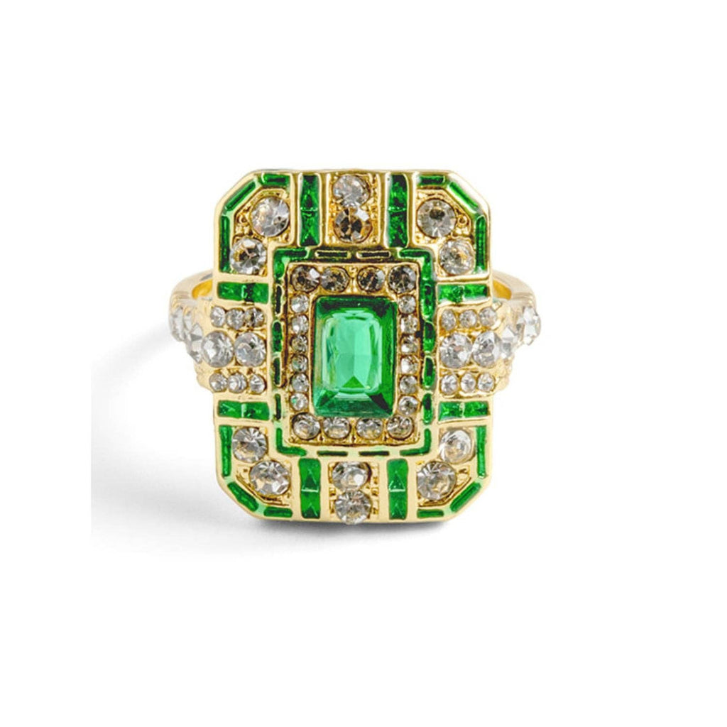 An ornate 14ct gold-plated Art Deco cocktail ring featuring a large rectangular emerald crystal centered on a geometric shield with green enamel and clear crystals.