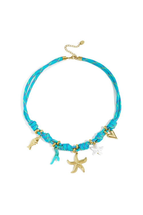 A vibrant turquoise braided cord necklace featuring gold starfish and fish charms, turquoise coral, and a white starfish charm on a white background.