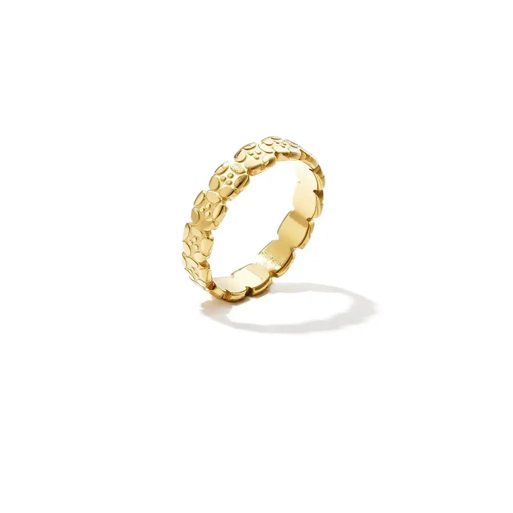 A gold-plated stainless steel waterproof band ring featuring a continuous repeating pattern of small four-leaf clovers with textured details and a scalloped edge. fleur-waterproof-clover-band-ring.webp