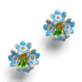 A pair of gold-plated Bill Skinner stud earrings shaped like highly detailed three-dimensional clusters of sky-blue and white forget-me-not flowers.