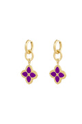 A pair of gold-plated huggie hoop earrings featuring an interlocking link and a dangling four-petal blossom pendant filled with magenta pink enamel and bordered by textured gold beads. giselle-blossom-enamel-huggie-earrings.webp