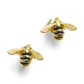 A pair of 3D gold bee stud earrings with hand-painted black enamel stripes and detailed wings on a white background.