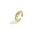 A gold-plated stainless steel adjustable double-row ring featuring one row of twisted nautical rope texture and one row of small sparkling clear pavé crystals. lira-double-row-cable-ring.webp
