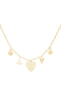 A gold-plated charm necklace featuring a central engraved sunburst heart pendant with a center crystal, paired with dangling charms of a ladybug, a butterfly, a small heart, and a scallop shell. meridien-sunburst-heart-charm-necklace.webp