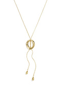 A gold-plated stainless steel lariat necklace featuring a fluid snake chain passing through a sculpted molten oval ring with two cascading chain ends finished with organic teardrop beads against a white background. paloma-molten-ring-lariat-teardrop-necklace.webp