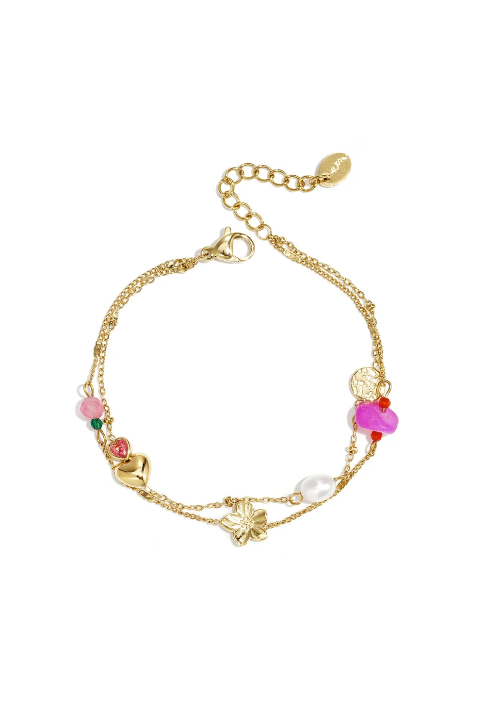 A gold-plated stainless steel double-layer charm bracelet featuring a central brushed gold flower, a puffed gold heart, a tiny pink crystal heart, a white pearl, a hammered coin, and an assortment of violet and pink beads against a white background. petale-layered-mixed-stone-charm-bracelet.webp