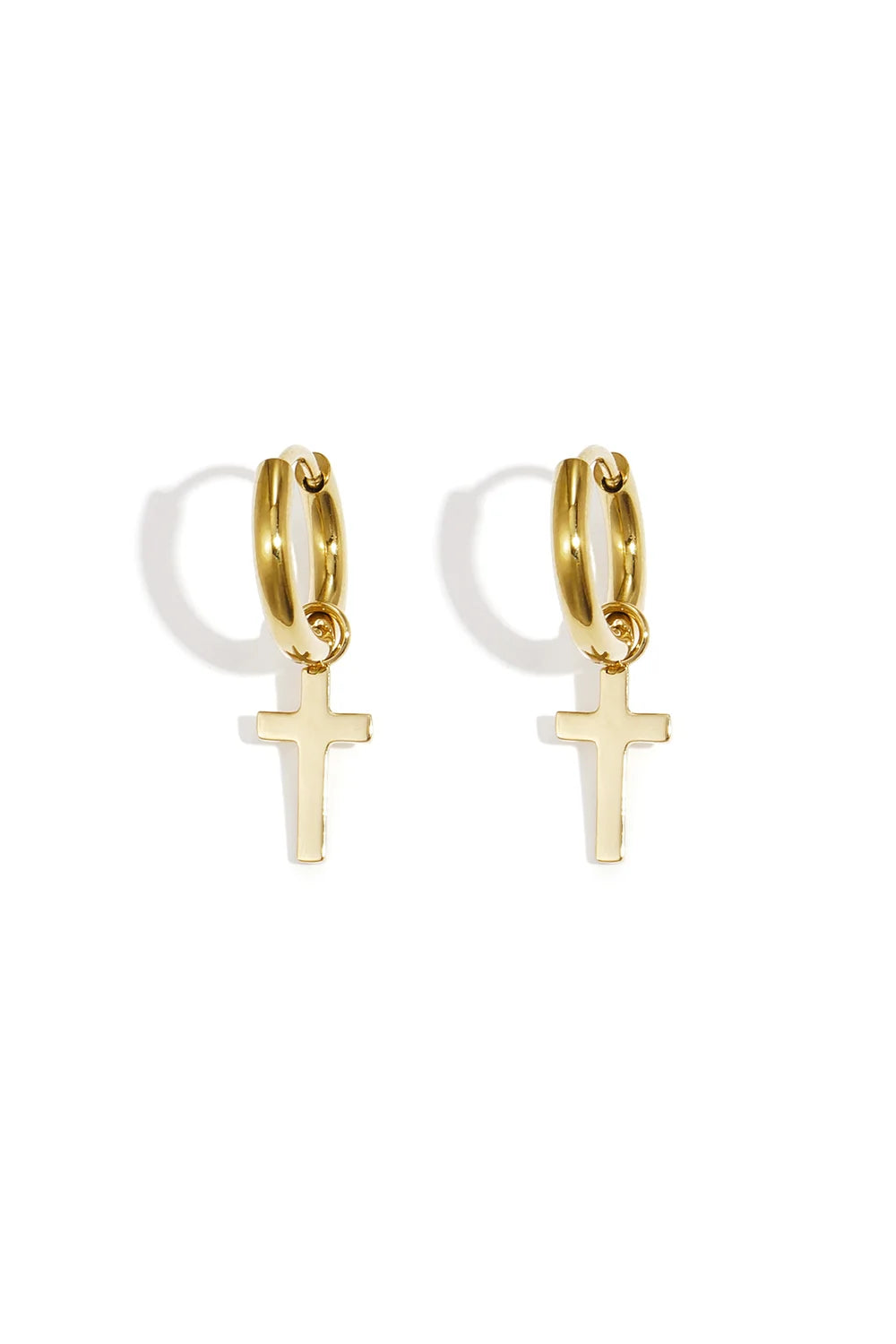 A pair of gold-plated huggie hoop earrings featuring a small, dangling minimalist flat cross charm with a high-polish mirror finish. providence-cross-huggie-earrings.webp
