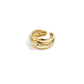 A wide gold-plated stainless steel multi-layer adjustable ring featuring two smooth high-polish bands, a center round solitaire crystal, and a fine rows of clear pavé crystals. sienna-multi-layer-solitaire-statement-ring.webp