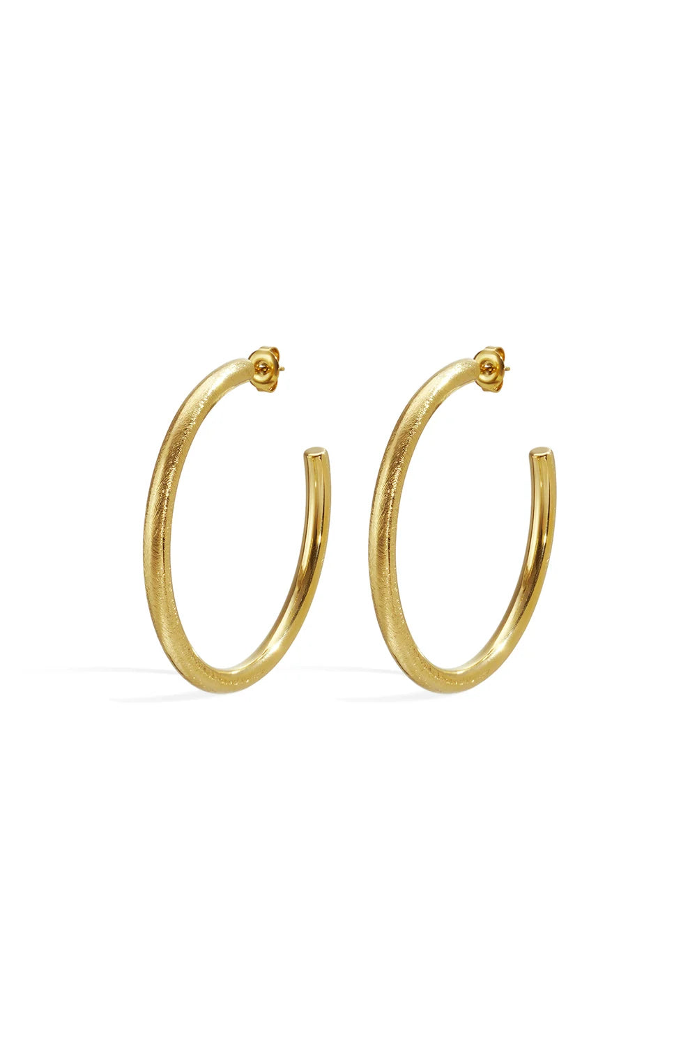 Pair of medium-sized gold C-hoop earrings with a brushed matte texture and butterfly post backings, shown on a white background.