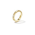 A gold-plated stainless steel ring featuring a faceted geometric band inlaid with alternating segments of white mother-of-pearl and small sparkling cubic zirconia crystals. sienne-mother-of-pearl-ring.webp