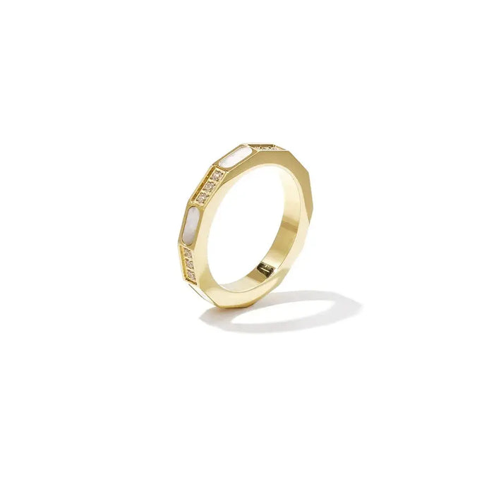 A gold-plated stainless steel ring featuring a faceted geometric band inlaid with alternating segments of white mother-of-pearl and small sparkling cubic zirconia crystals. sienne-mother-of-pearl-ring.webp