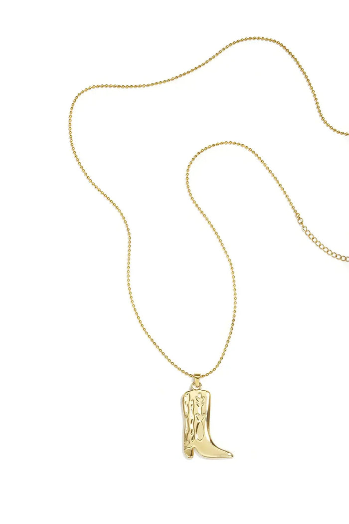 A gold-plated stainless steel ball chain necklace featuring a sculpted cowboy boot pendant with engraved Western stitch detailing against a white background. sierra-western-cowboy-boot-ball-chain-necklace.webp