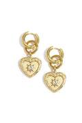 A pair of gold-plated stainless steel huggie hoop earrings featuring a cascading drop of a secondary ring and a textured baroque heart medallion coin with an engraved starburst and a tiny clear cubic zirconia center against a white background. stella-celestial-heart-medallion-huggie-earrings.webp