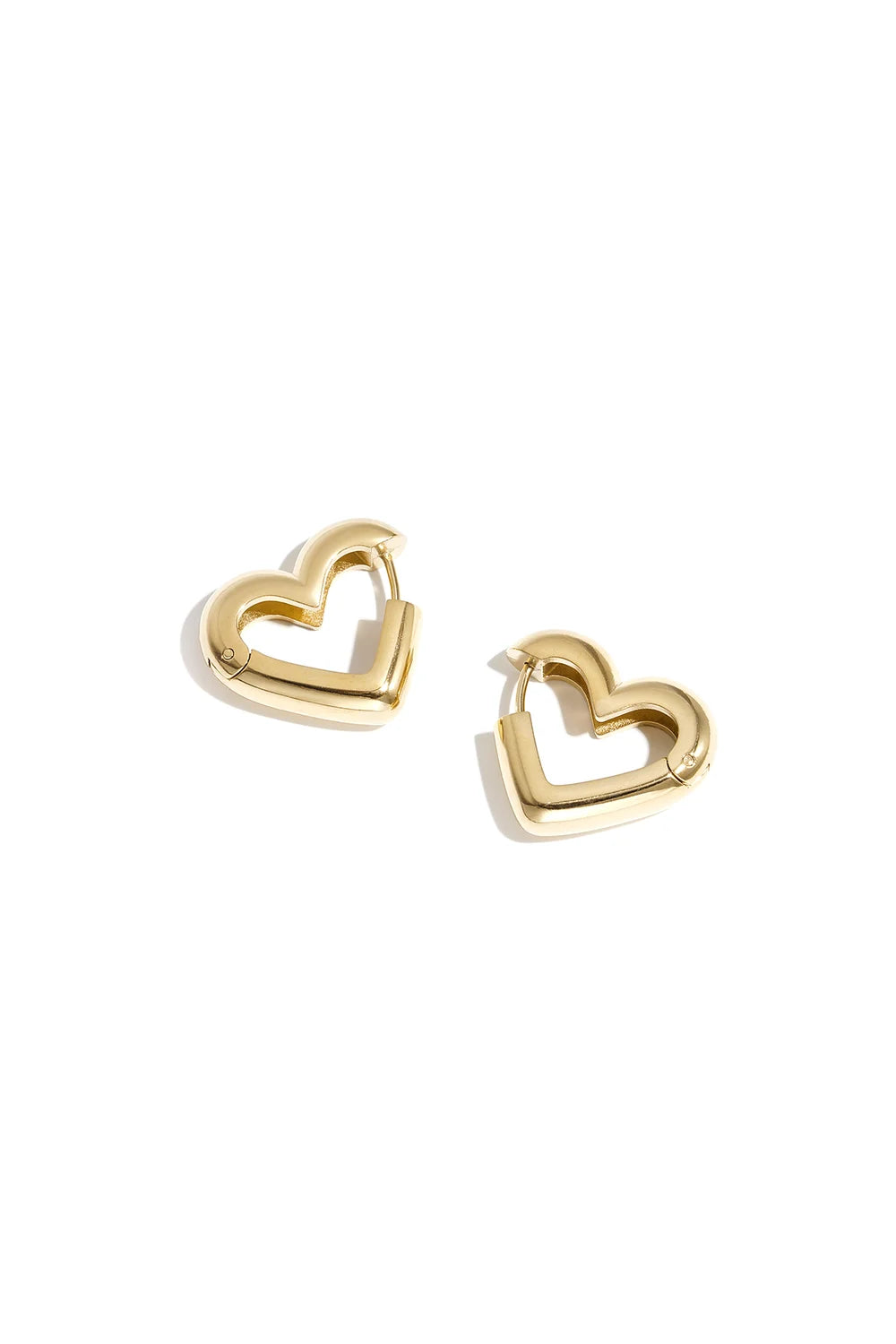 A pair of chunky gold heart-shaped hoop earrings on a clean white background.