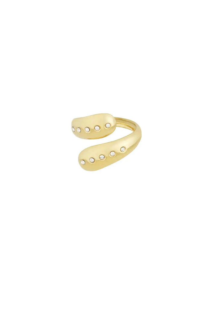 A gold-plated stainless steel bypass ring featuring a thick open wrap band with teardrop droplet terminals inlaid with lines of small clear crystals against a white background. thea-droplet-bypass-ring.webp