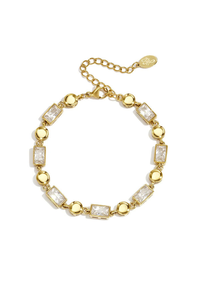 Gold station bracelet with baguette crystals and polished gold beads