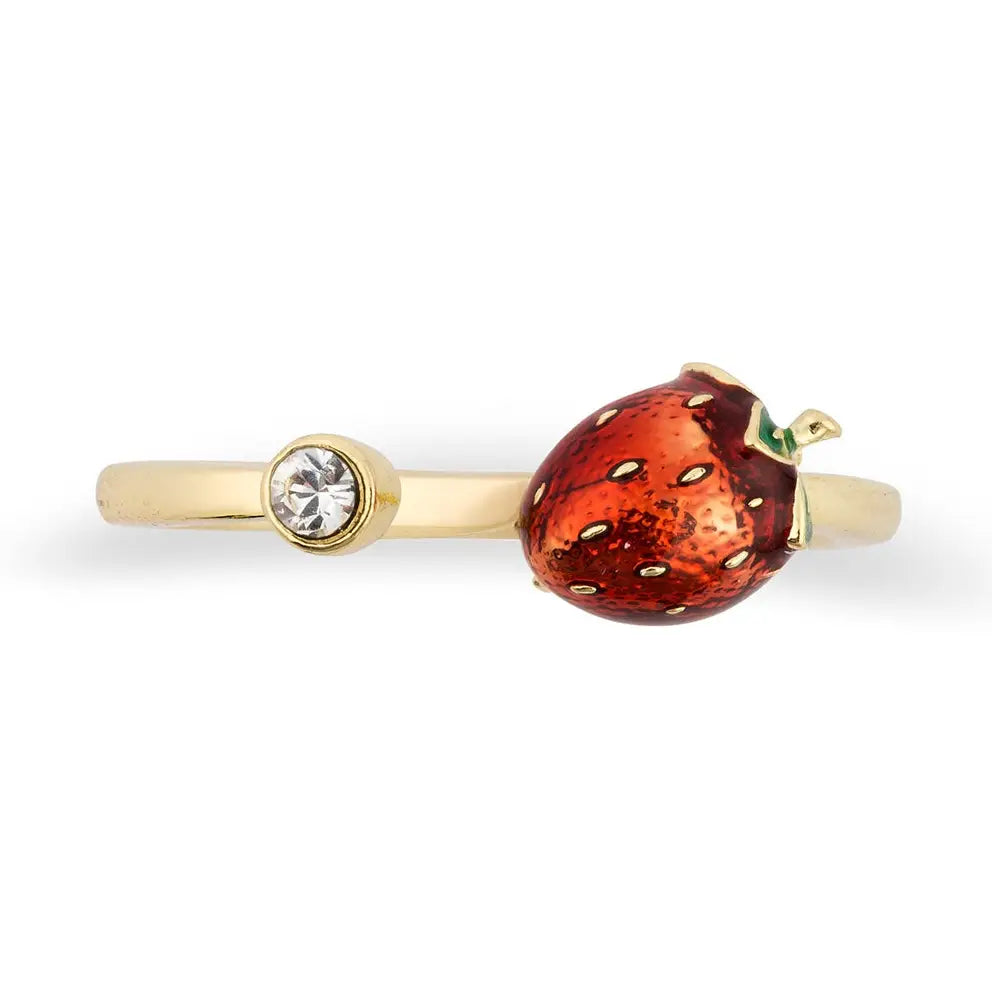 A gold-plated open bypass ring by Bill Skinner featuring a realistic 3D strawberry hand-painted with glossy red enamel and gold seeds, balanced by a bezel-set clear crystal. strawberry-enamel-ring.webp